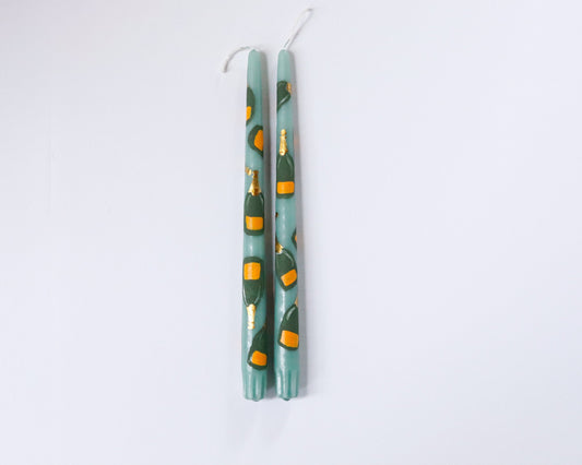 hand-painted taper candlestick with champagne bottle
